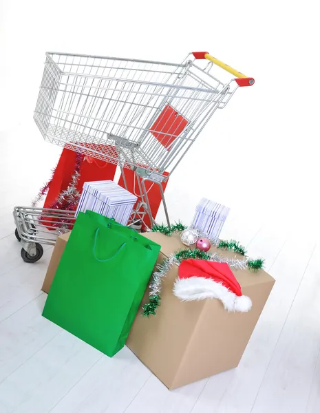 Shopping cart with boxes and bags, happy holidays — Stock Photo, Image