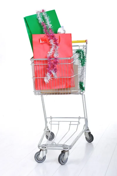 Shopping trolley cart with present boxes and bags — Stock Photo, Image