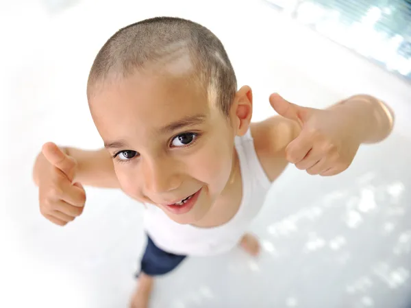 Thumbs up! Little boy, cute short hair, almost bald :) Royalty Free Stock Images