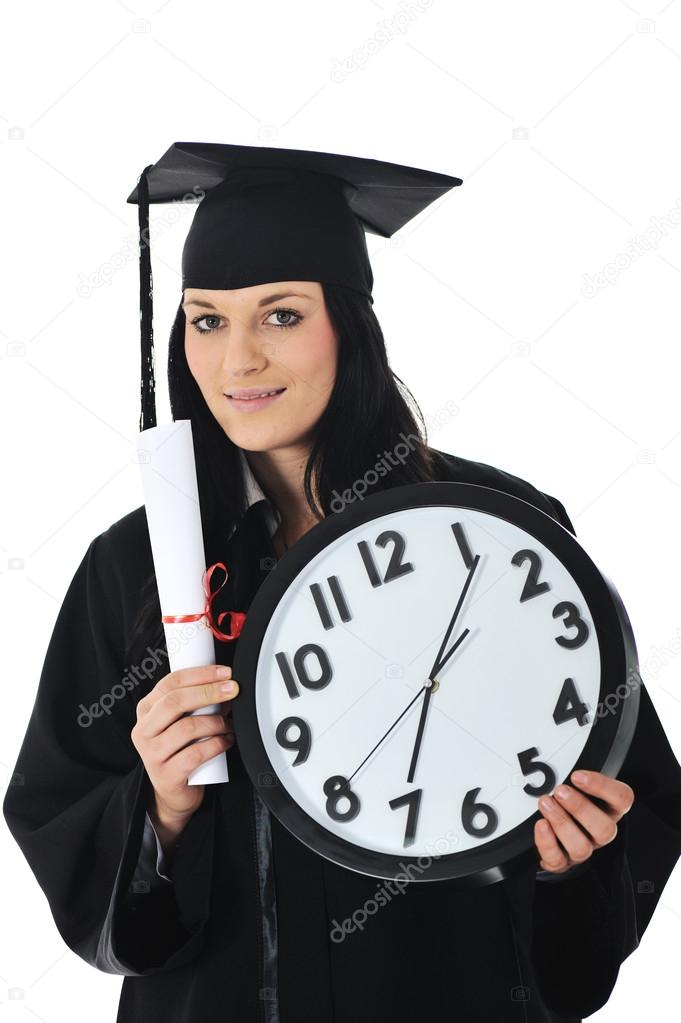 Graduate girl student in gown with diploma and clock
