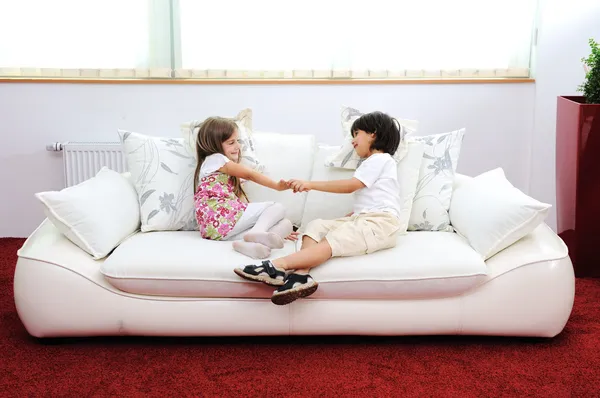 Children at new home with modern furniture — Stock Photo, Image