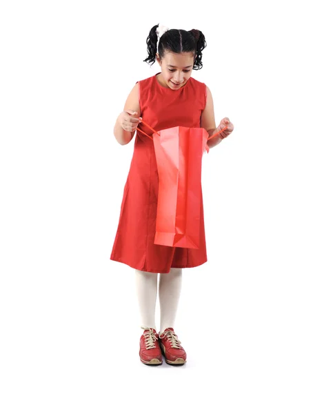 Little girl with shopping bags and boxes, isolated — Stock Photo, Image