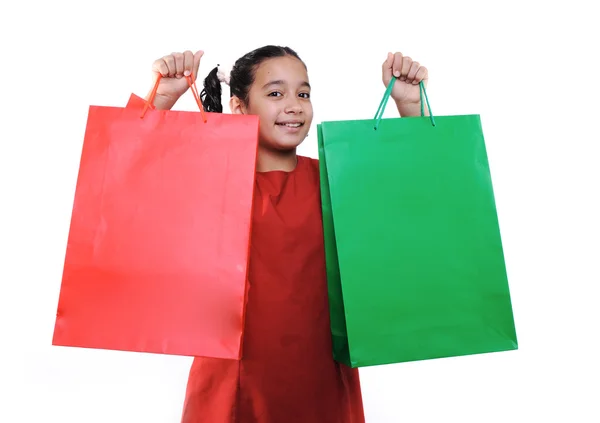 Petite fille avec sacs et boîtes à provisions, isolée — Photo