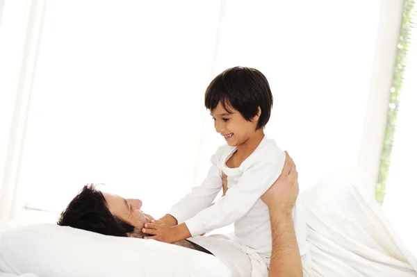 Father and son in bed, happy time — Stock Photo, Image