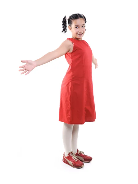 Adorável preteen escola menina vestindo vestido vermelho isolado, posando Fotografia De Stock
