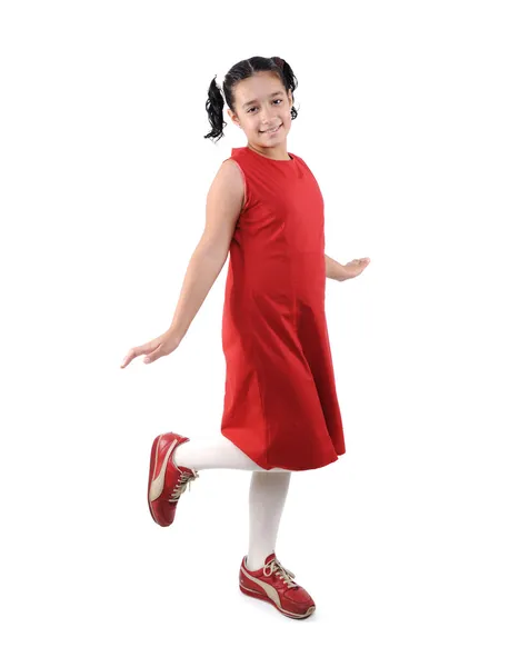 Schattig preteen school meisje dragen rode jurk geïsoleerde, poseren Stockafbeelding