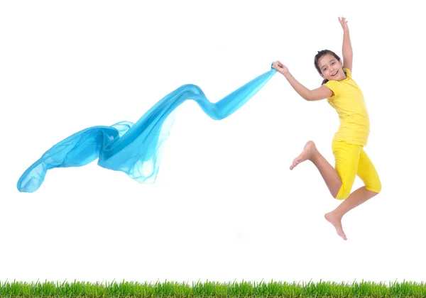 Beautiful scene, isolated girl with scarf jumping above grass — Stock Photo, Image