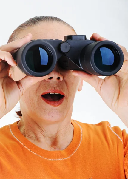 Elderly woman with binoculars — Stock Photo, Image