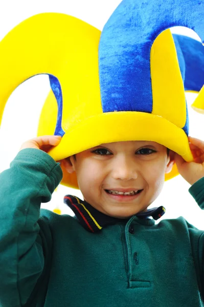 Happy smiling child in a big hat isolated on white — Stock Photo, Image