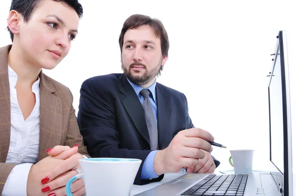 Two persons in office on laptop Royalty Free Stock Images