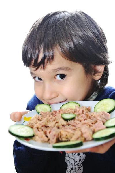 Kid with tuna on plate — Stock Photo, Image