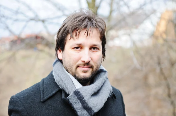 Young man with winter coat — Stock Photo, Image