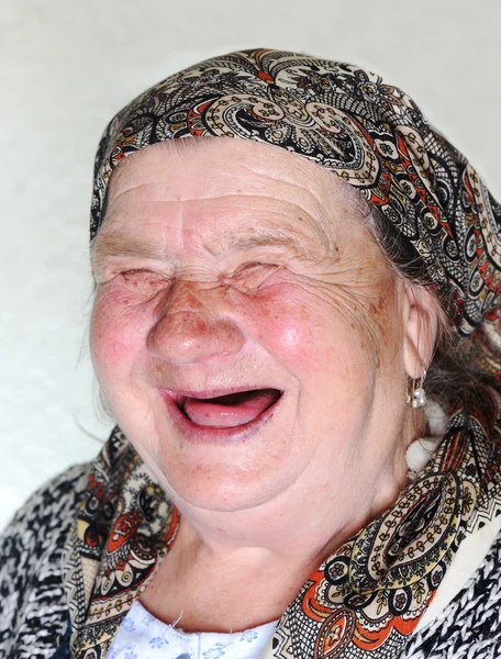 Elderly person, portrait in natural pose laughing — Stock Photo, Image