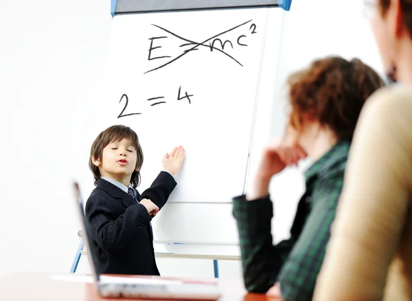 Genius kid on business presentation speaking to adults and giving them a lecture — Stock Photo, Image
