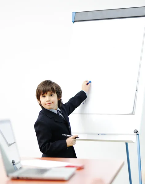 Genius kid on business presentation speaking to adults and giving them a lecture — Stock Photo, Image