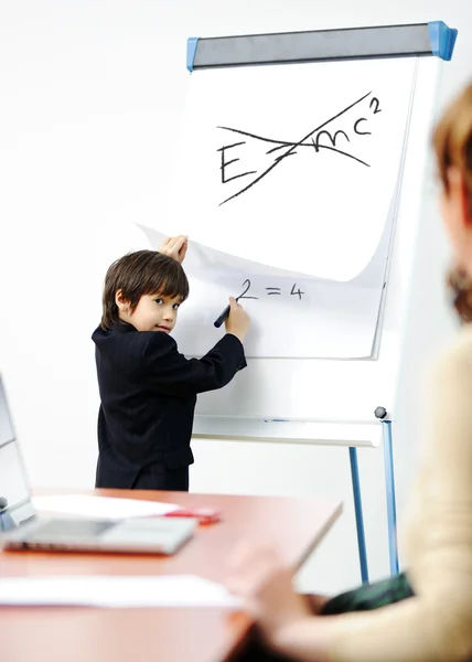 Genius kid on business presentation speaking to adults and giving them a lecture — Stock Photo, Image