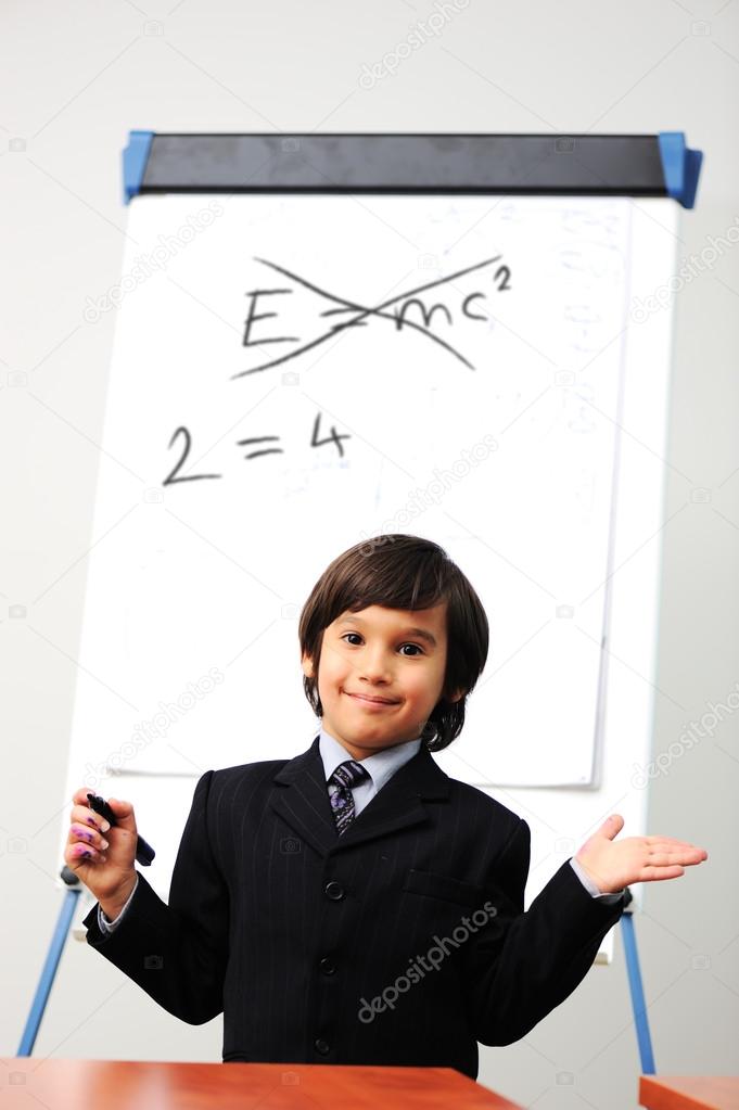 Genius little boy writting on the board, new formula instead, conceptual idea