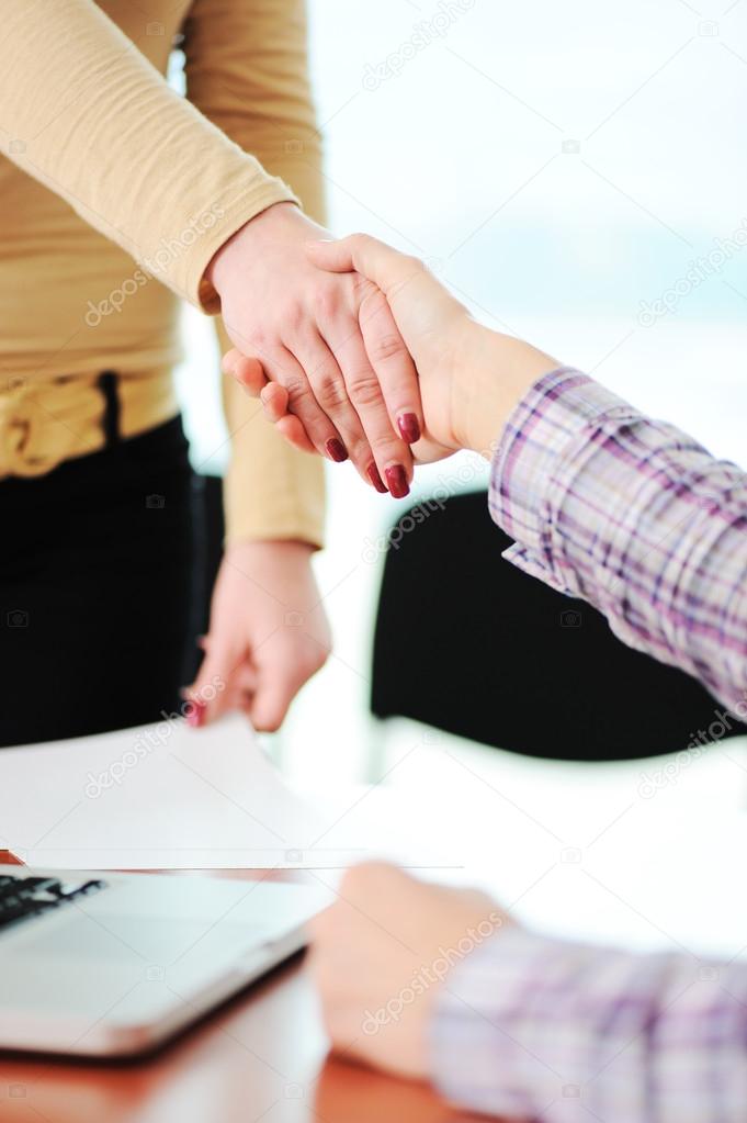 Closing a successful deal with a handshake. Congratulations! Getting a new job.