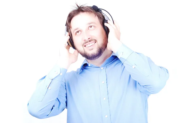 Junger weißer schöner Mann mit Kopfhörern — Stockfoto