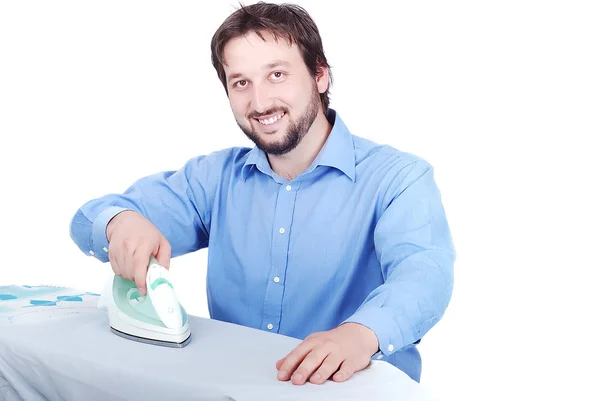 Joven feliz planchando ropa —  Fotos de Stock