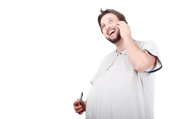 Young man with big stomach speaking on phone — Stock Photo, Image