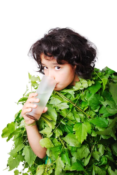 Nice little girl in leafs cloths drinking water — Stock Photo, Image