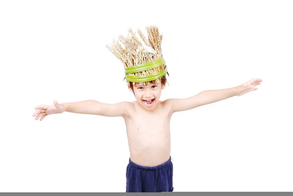 Cute kid with wheat hat on head with hands up Royalty Free Stock Images