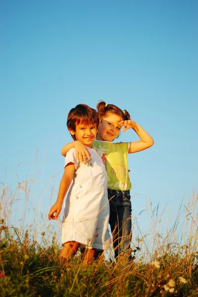 Romantic vision of two children standing together outdoor — Stock Photo, Image