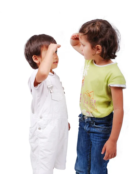 Two children measuring their height — Stock Photo, Image