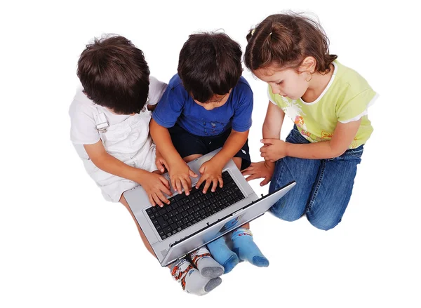 Kinderen activiteiten op laptop geïsoleerd in wit — Stockfoto