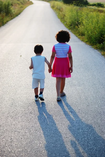 Brother and sister walking — Stock Photo, Image
