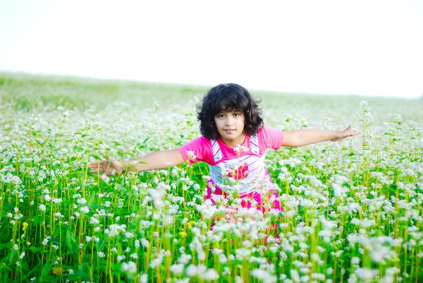 Adorable girl on green grass — Stock Photo, Image