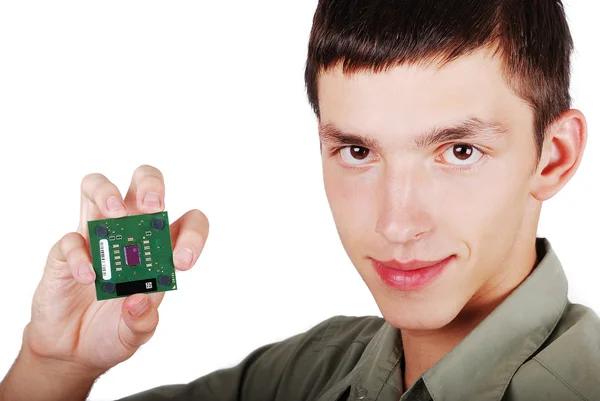 Jovem masculino segurando processador de computador — Fotografia de Stock