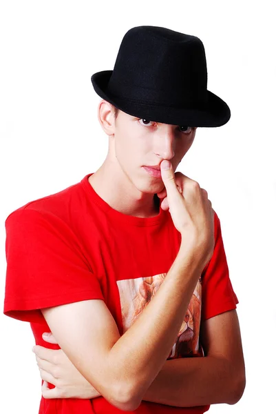 Young model with hat on head and thinking expression — Stock Photo, Image