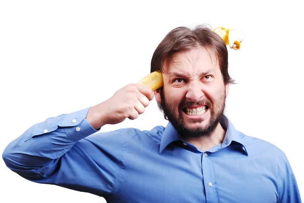 Молодий чоловік підриває мозок бананом — стокове фото