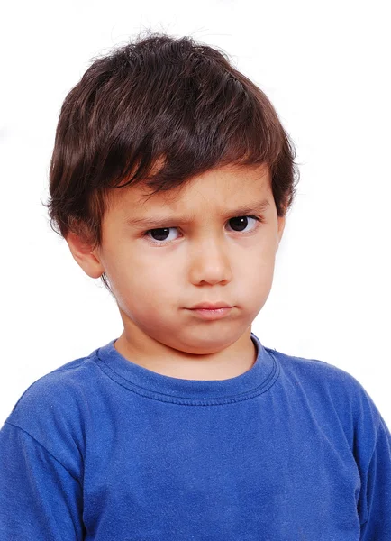 Ragazzo carino con espressione arrabbiata sul suo viso Immagine Stock