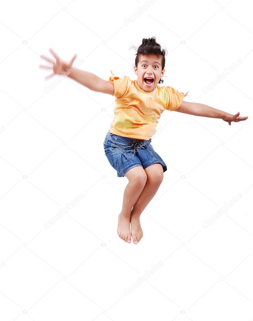 Happy cute girl in white clothes is jumping isolated