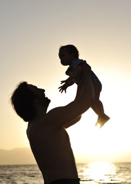 Father and son on the Beach - Silhouette Shot clipart