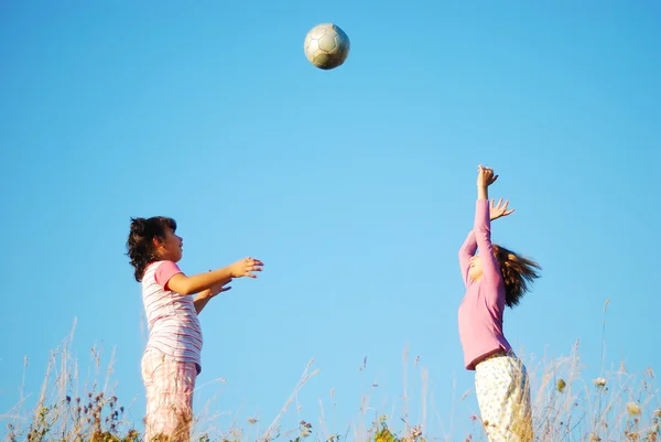 Girls play with ball — Stock Photo, Image