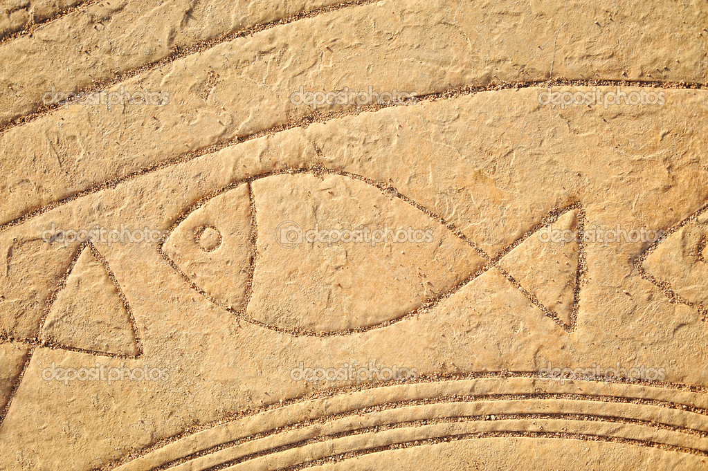 Fish in stone, old symbol, art — Stock Photo © zurijeta #21479727