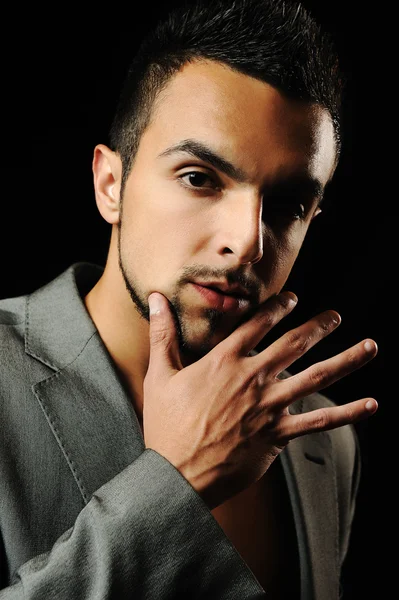 Young modern style macho man is posing , studio shot — Stock Photo, Image