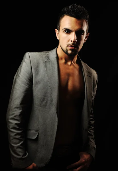 Young modern style macho man is posing , studio shot — Stock Image Young modern style macho man is posing , studio shot Stock Photo