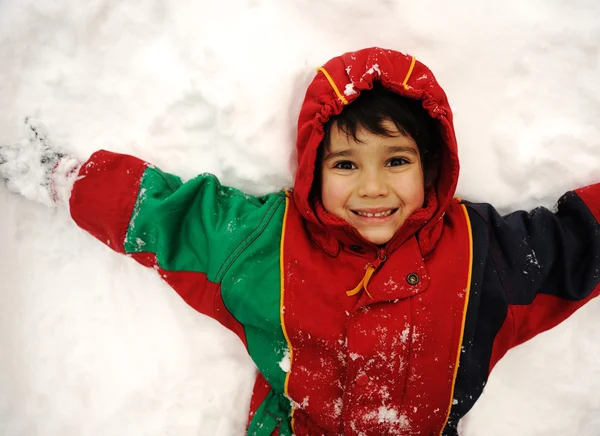 Enfant mignon dans la neige, temps de neige, hiver, bonheur Images De Stock Libres De Droits