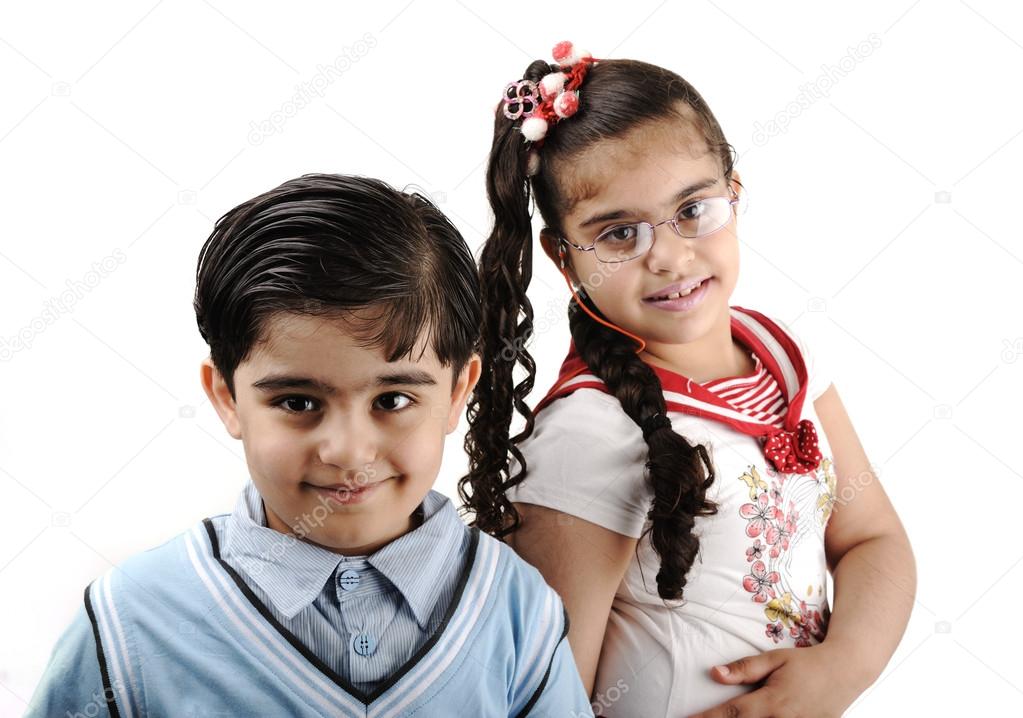 Two children, brother and sister, isolated on white, mixed race