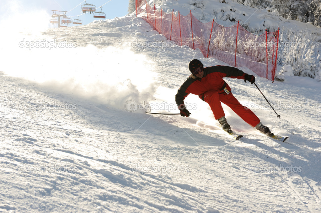 Skiing at ski resort, blured skier in fast motion, extreme sport