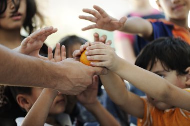 Hungry children in refugee camp, distribution of humanitarian food clipart