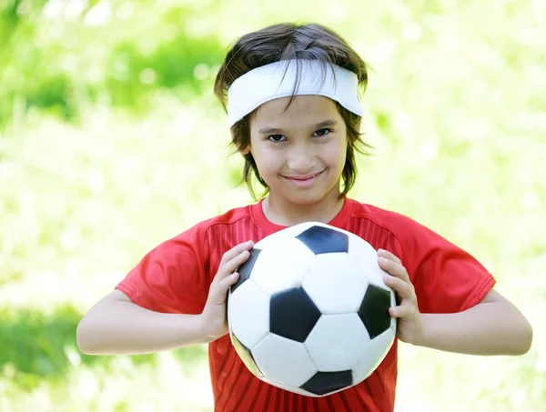 Young boy with soccer outdoor — Stock Photo, Image