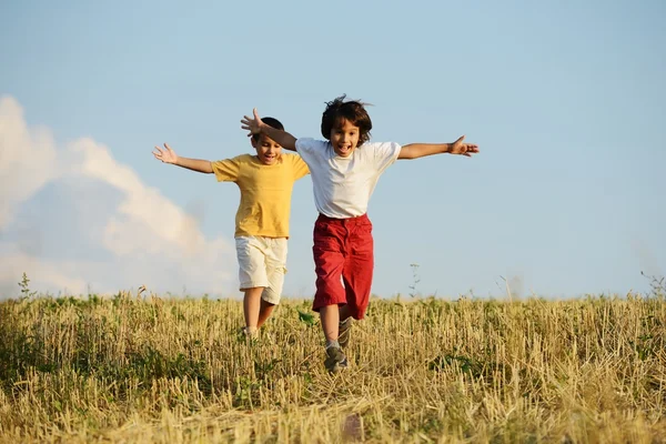 Two kids on meadow — Stock Photo, Image