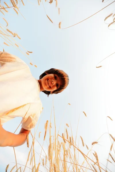 Happy child at harvest field — Stock Photo, Image