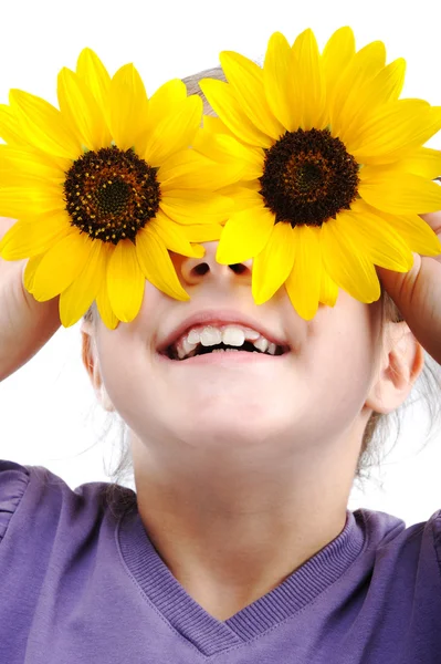 Szczęśliwa dziewczynka z słoneczniki na oczy — Zdjęcie stockowe